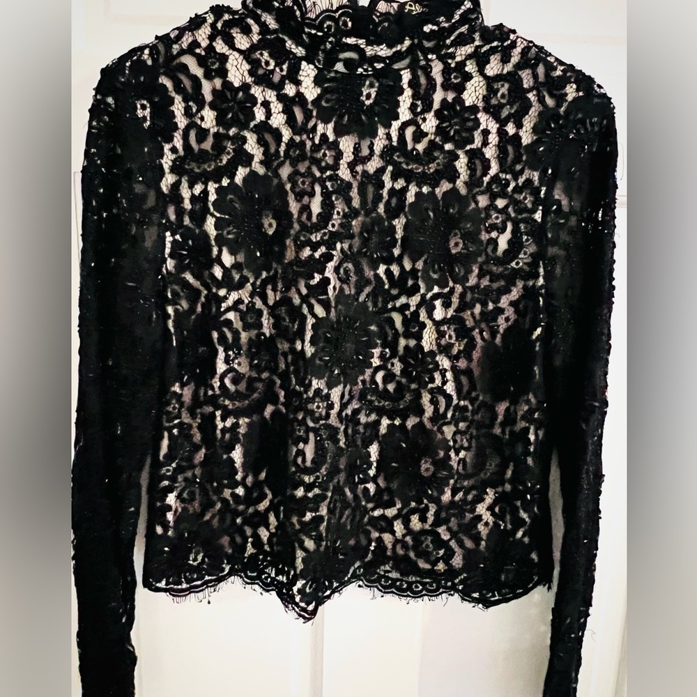 NWT-  Alice and Olivia long sleeve lined beaded lace top in black.  Size 12